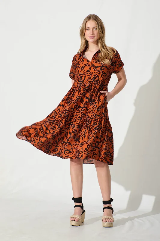 Your Dream Deal is Here!Ann Smock Dress in Rust with Black Print