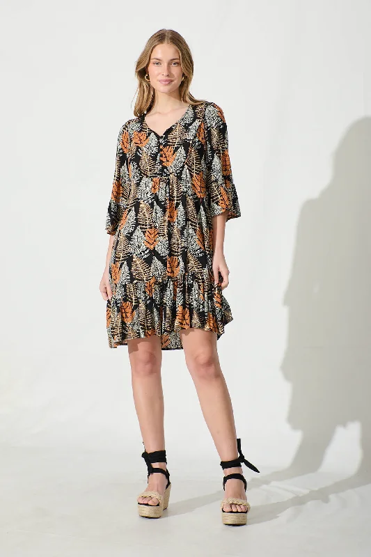 Exclusive Offers You’ll Love!Mara Smock Dress in Black with Multi Leaf Print